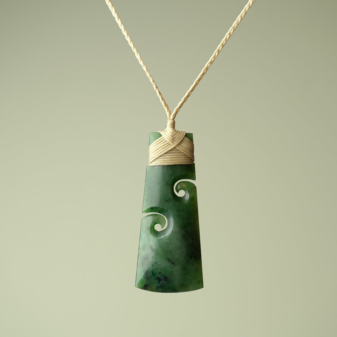 Large Pounamu Toki with Koru, Tan Binding